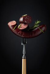 Black pudding or blood sausage with rosemary.