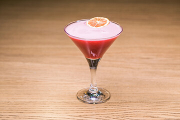 Alcoholic cocktail on wooden board