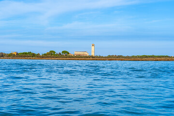 Torcello, Venice, Italy: Panoramic view of Torcello island in Venice bay on the Adriatic Sea as seen from Burano - 556449663