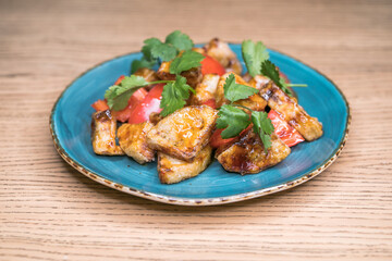 Restaurant dish fried eggplant with tomatoes