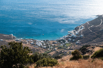 Bay and village of Isternia, Tinos Island with Cycladic houses, crystal clear water of the Aegean...