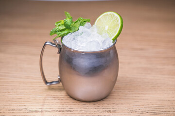 Alcoholic cocktail on wooden board