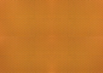 Fototapeta premium Large texture background depicting a traditional japanese furoshiki fabric printed with a seamless dotted pattern of rainbows or waves geometrical design called Seigaiha on a gold-brown color.