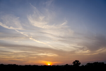 Yellow sky clouds from the sun's rays are about to set,Photograph of the sunset in the countryside in the evening