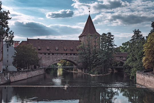 view of the pegnitz river and the old chain bridge in nuremberg