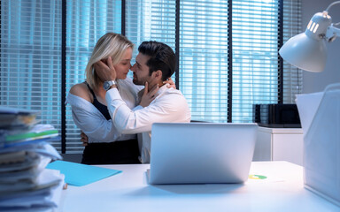 Boss and secretary having sex on the table in office.