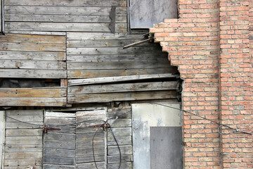 Abstract wall of bricks and wooden planks. Texture background.