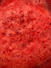 Photo of a red foaming liquid