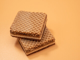 Crispy waffles with cocoa cream and nuts. Wafers with chocolate and nuts.