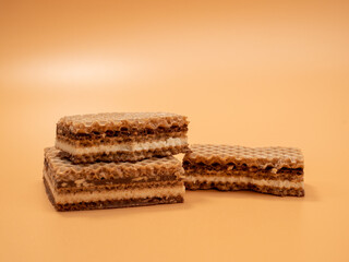 Crispy waffles with cocoa cream and nuts. Wafers with chocolate and nuts.