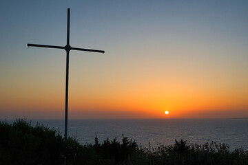 Silhouette of cross on a sunset background, Peloponnese, Greece