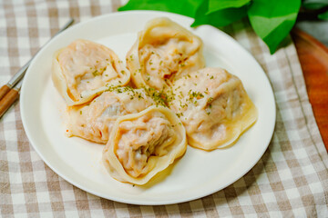 kimchimandu, Korean Kimchi dumpling : Kimchi dumplings are stuffed with a filling of chopped kimchi, bean curd, and vegetables. They are the most popular type of dumpling among Koreans.