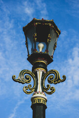 Fototapeta na wymiar Typical Street Lamp in Malioboro with blue sky background and white cloud.