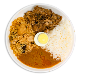 Homemade healthy non veg lunch combo meal with chicken briyani, white rice, mutton roast or curry or masala, chicken gravy or kozhambu with boiled egg.
