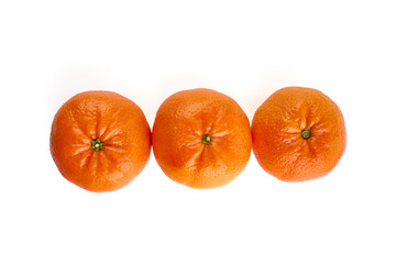 Tangerine or clementine, close-up, isolated on a white background.