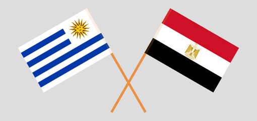 Crossed flags of Uruguay and Egypt. Official colors. Correct proportion