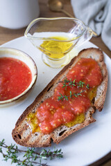 Healthy breakfast, bread with olive oil and tomato and coffee