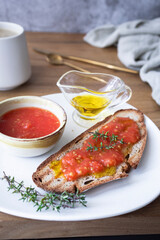 Healthy breakfast, bread with olive oil and tomato and coffee