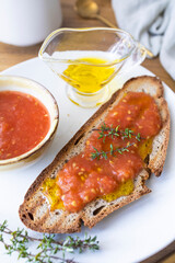 Healthy breakfast, bread with olive oil and tomato and coffee