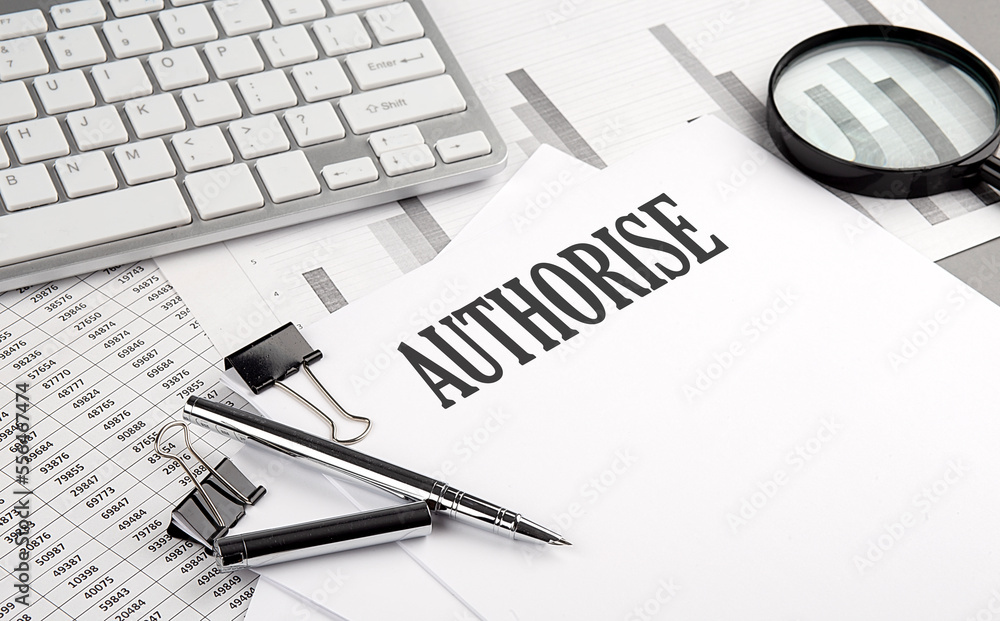 Aufkleber authorise text on paper with chart and keyboard, business concept