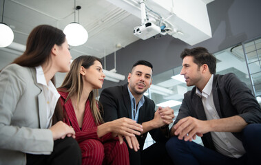 New business group person get serious about doing business, Even during the meeting's break, they continued to analyze and exchange ideas.