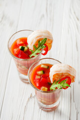 delicious summer gazpacho cocktail on a white wooden rustic background
