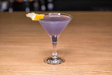 Alcoholic cocktail on wooden board