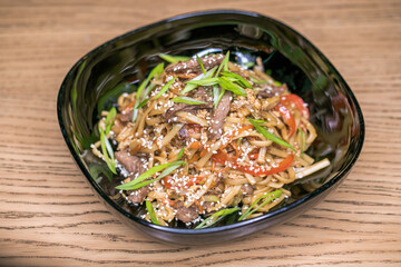 Restaurant dish homemade noodles with meat.