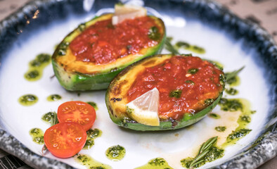 Restaurant dish fried avocado with tomato sauce