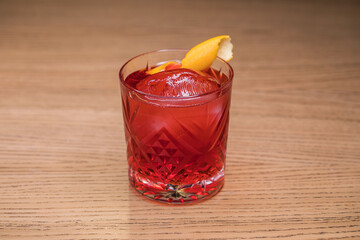 Alcoholic cocktail on wooden board