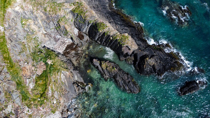 Epic cliffs of Ireland. The picturesque coast of the Celtic Sea, West Cork. Seascape, top view. Drone photo.