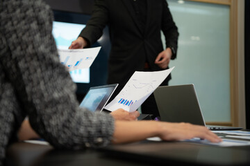 New business people in the conference room are exchanging information with each other along with rehearsing important information