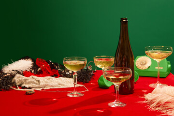 Christmas party aesthetics. Table with red tablecloths served with champagne. New year celebration