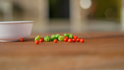 Withania somnifera or ashwagandha leaves and red fruit berries in white cup. winter cherry. healthcare