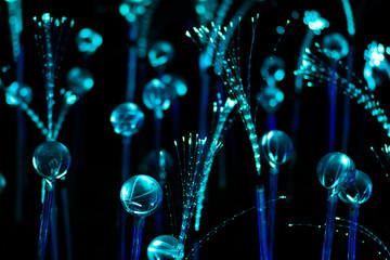 White and blue fiber optic strands or filaments creating a magic fantastic abstract background
