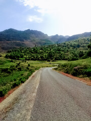 Gravel road through the countryside and mountains