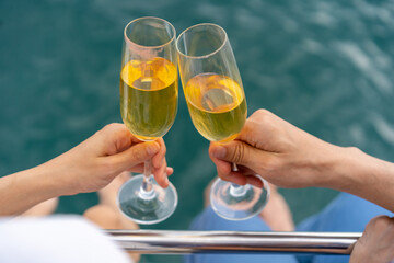 Asian man and woman couple enjoy luxury outdoor lifestyle celebration party drinking champagne...