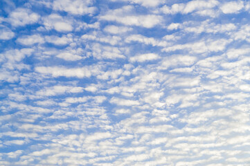 Beautiful blue sky with full strange white cloud and clear light under shining from the sun in the morning