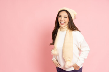 Happy young Asian woman traveler in sweater shirt smiling isolated on pink background