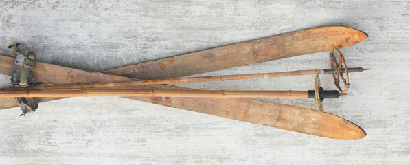 vintage wooden skis on white wooden background