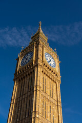 Looking up to the Big Ben clock tower in downtown London with Blue skies