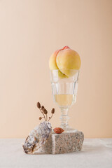 still life in beige tones. The Mediterranean. White wine with peach and oyster.