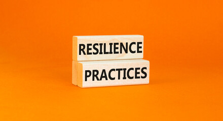 Resilience practices symbol. Concept word Resilience practices typed wooden blocks. Beautiful orange table orange background. Business and resilience practices concept. Copy space.