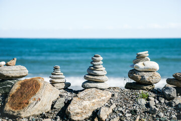 Stack small stones along w West Coast South Island beach