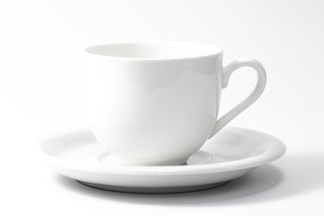 White cup and saucer isolated on white background.