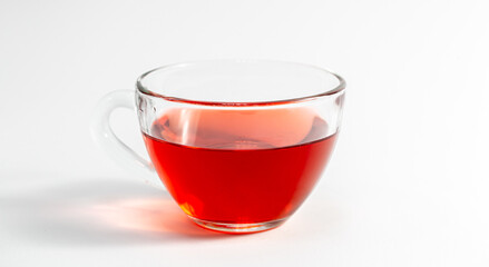 Glass cup with tea on a white background isolated.