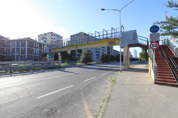 Concrete footbridge over motorway. Stock photo.