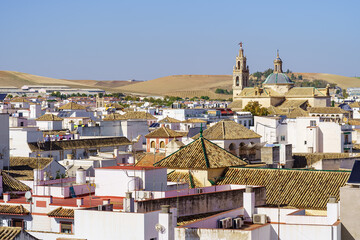 Panoramic view of the city of Ecija with its white houses, Arab roofs and church towers, Seville.