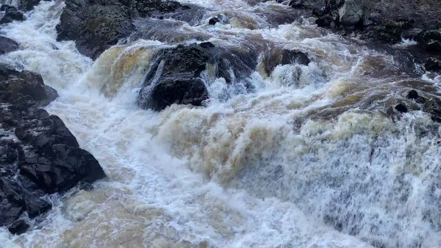 River Dee fast flowing due to high water level during the winter at the Bridge of Feugh