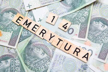 inscription 14 Emerytura which means 14 pension next to polish money. Concept showing program of...